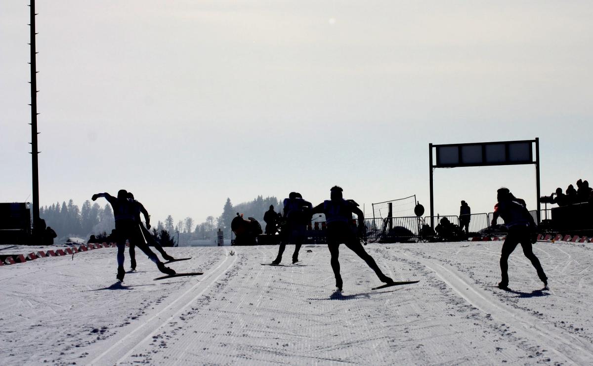 A group of cross-country skiers competing