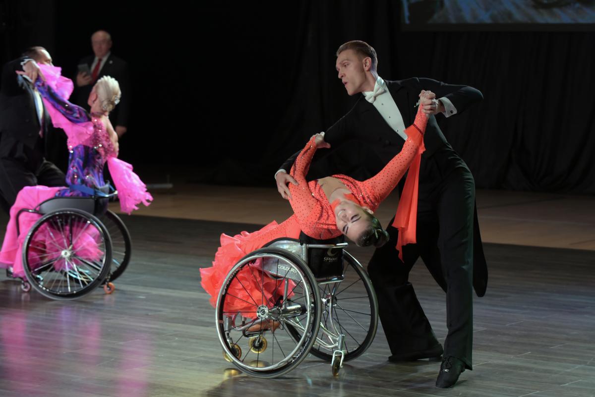 Para dancers Hanna Harchakova and Roman Usmanov in a ballroom pose on the dance floor