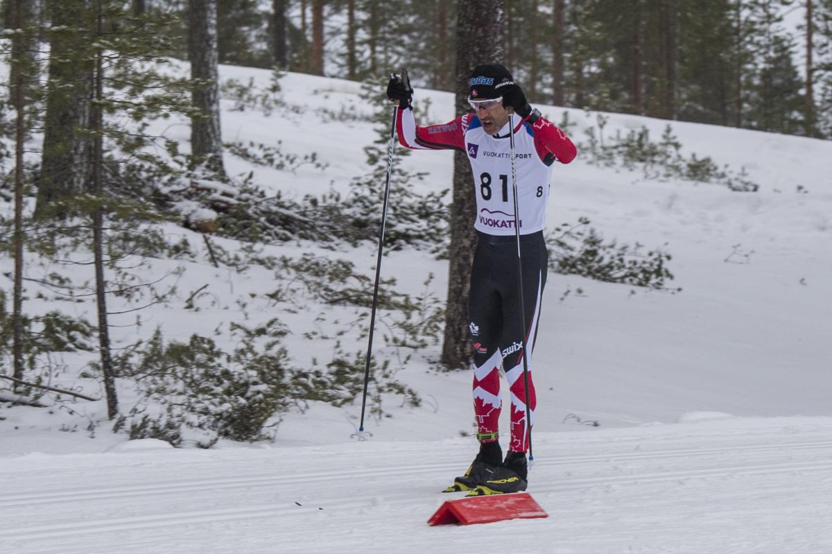 male Para Nordic skier Brian McKeever stands on skis 