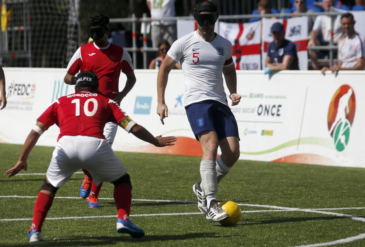 Dan English - Madrid 2018 male blind footballer Dan English dribbles the ball past an opposition player