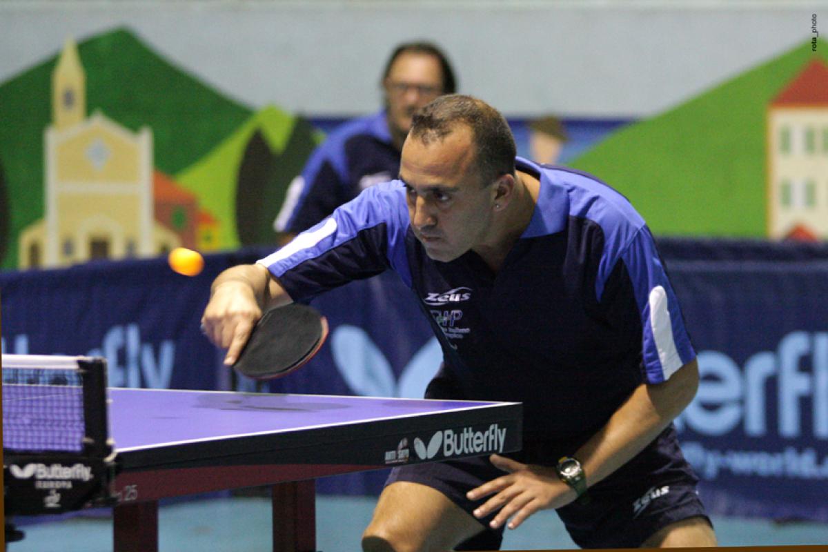 INAS Global Games 2011- table tennis a male intellectually impaired table tennis player plays a backhand across the table