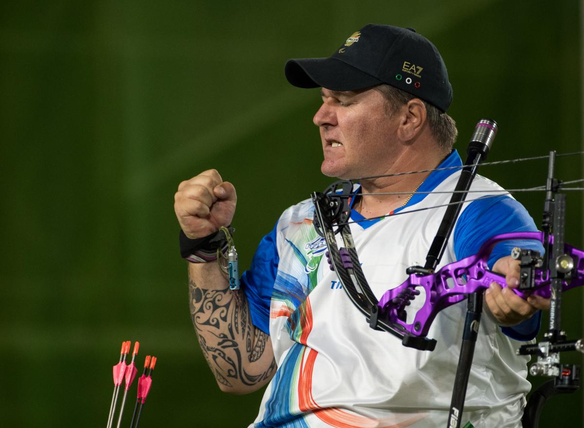 male Para archer Alberto Simonelli celebrates a clean shot