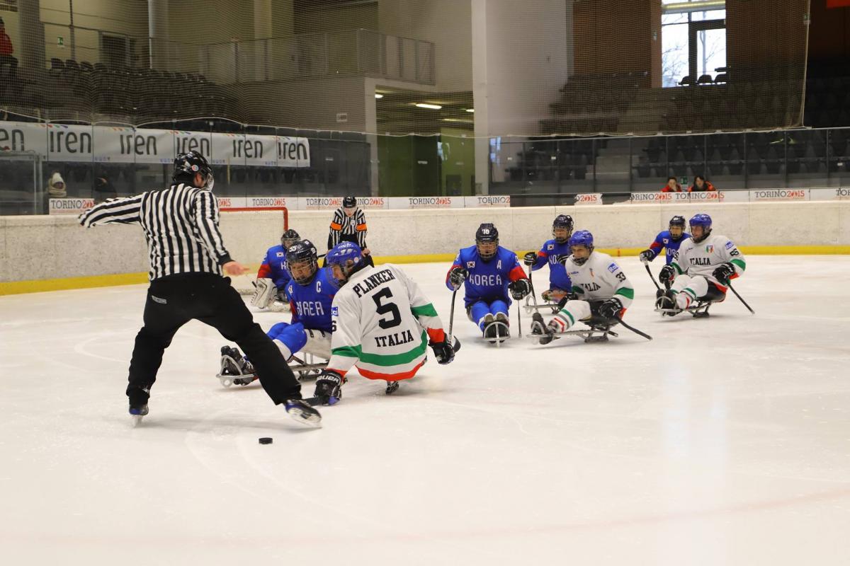 Italy v South Korea - 2019 Torino Para Ice Hockey International Tournament Two referees, three Italian and five South Korean Para ice hockey players on ice