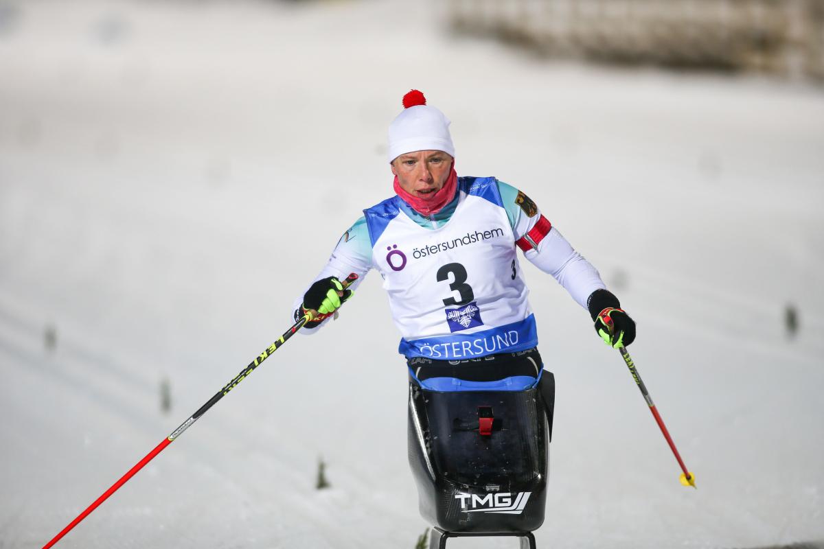 female Para Nordic skier Andrea Eskau steers on the ski course