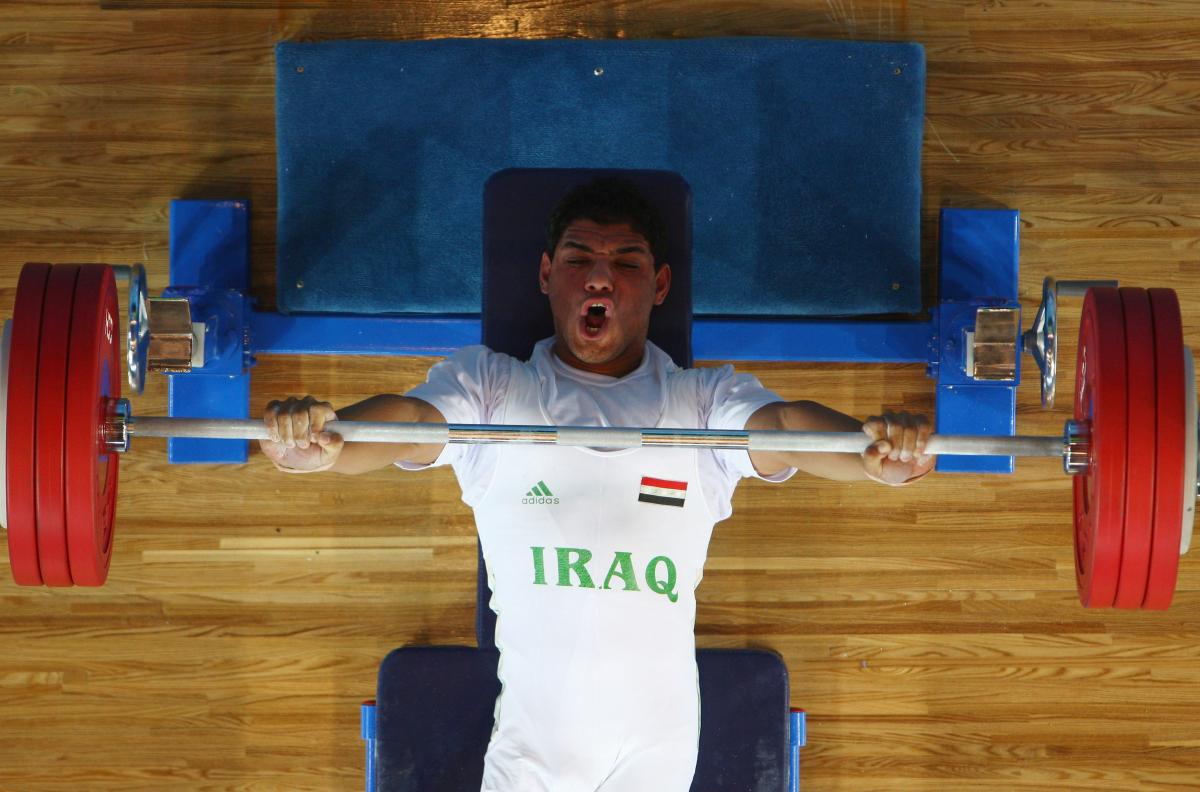 Rasool Mohsin - Iraq male powerlifter Rasool Mohsin yells as he lifts the bar