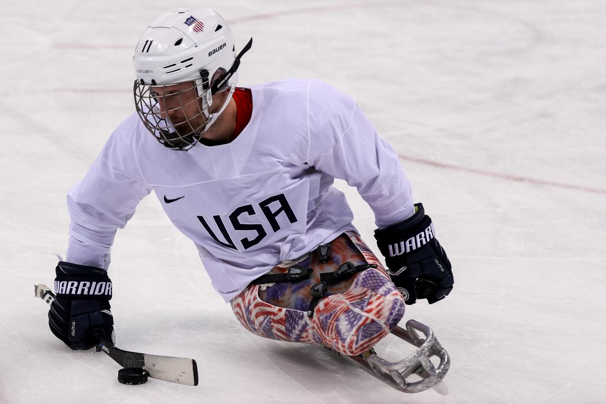 male Para ice hockey player Tyler Carron on the ice