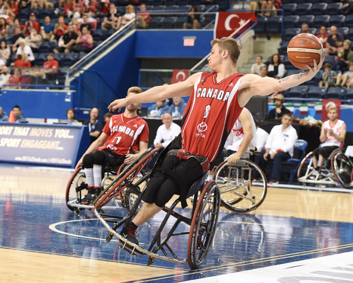 Liam Hickey - Canada male wheelchair basketballer Liam Hickey tilts sideways as he prepares to throw the ball