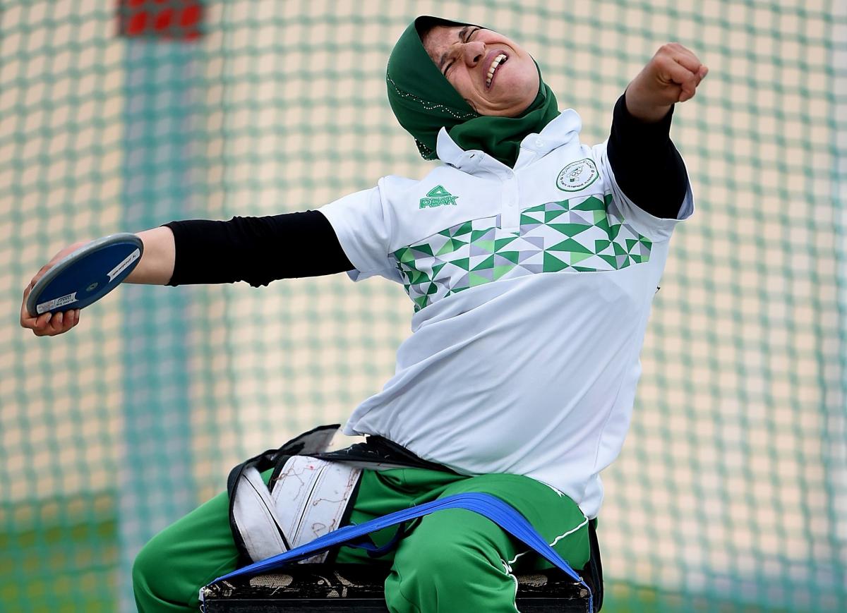 Female Para athlete Mounia Gasmi throws a discus