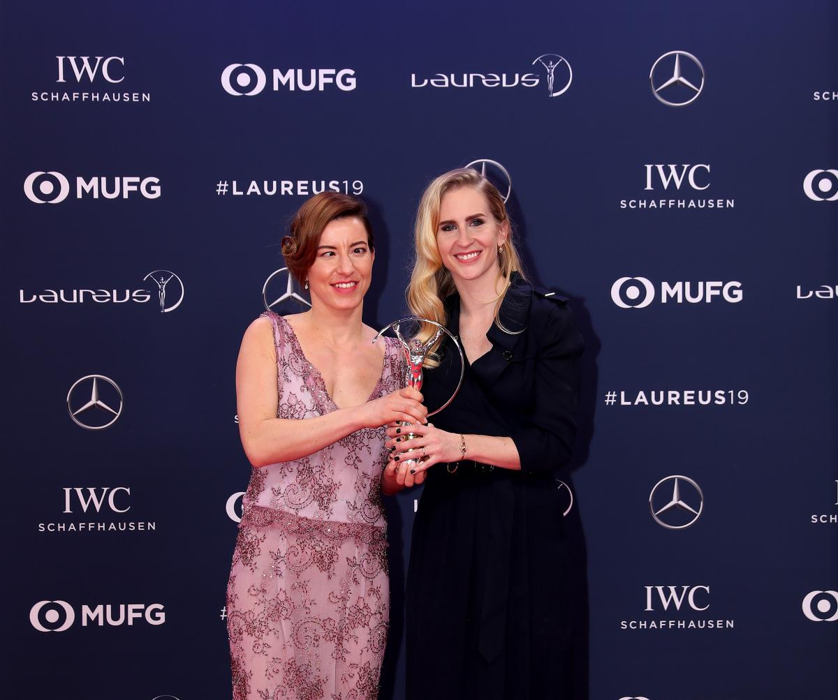 female Para alpine skier Henrieta Farkasova and guide Natalia Subrtova holding a silver Laureus trophy