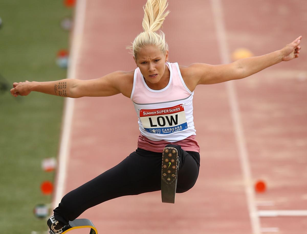 Vanessa Low - Canberra Festival of Athletics female Para athlete Vanessa Low jumps high above the long jump sandpit