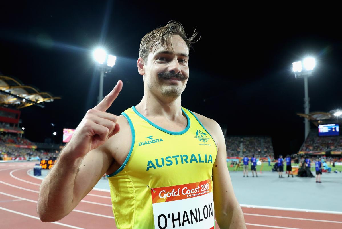 male Para sprinter Evan O'Hanlon gives a thumbs up to the camera