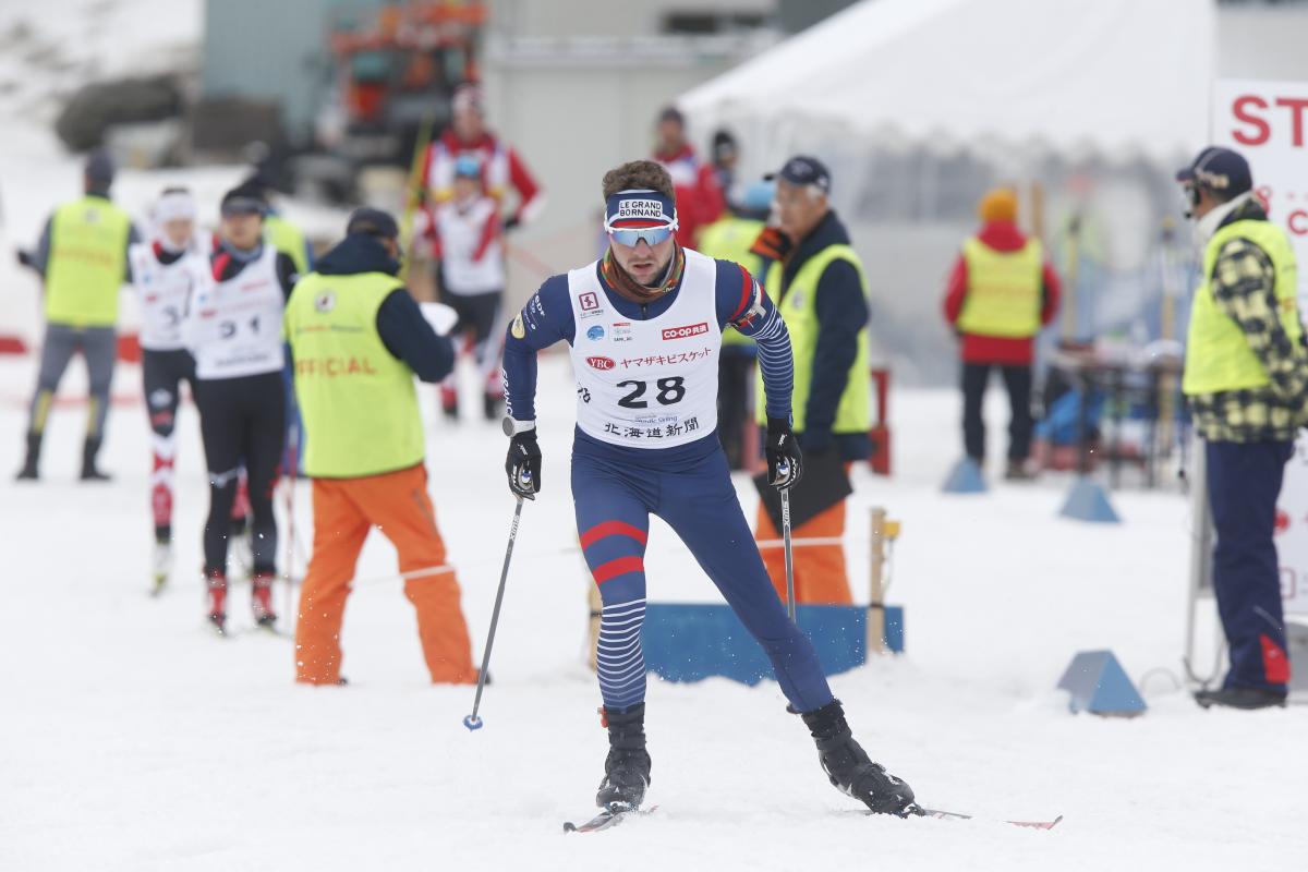 male Para Nordic skier Benjamin Daviet skis towards the finish line