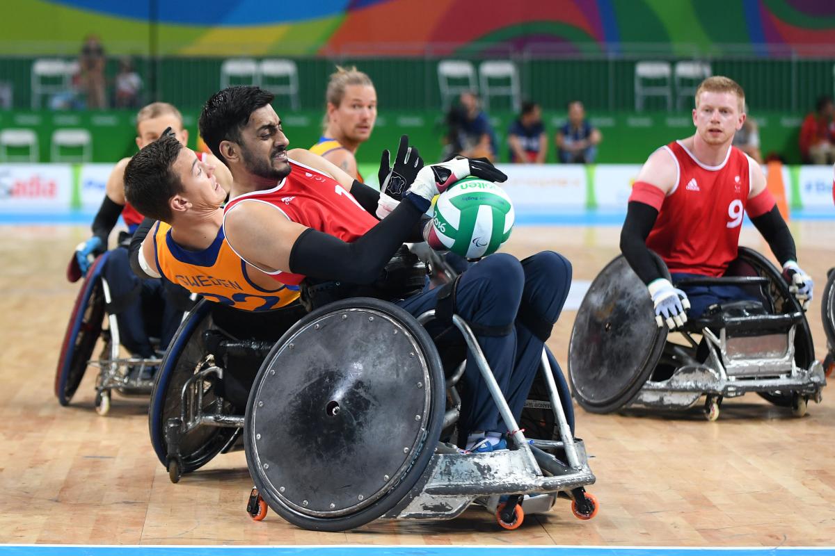 Great Britain wheelchair rugby wheelchair rugby players grappling for the ball