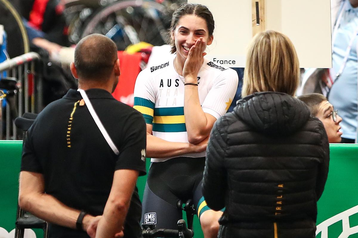 Paige Greco - Apeldoorn 2019 female Para cyclist Paige Greco smiles at two team officials