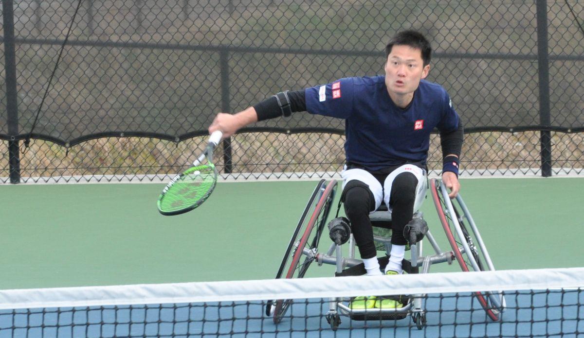 male wheelchair tennis player Shingo Kunieda prepares to play a backhand on a hard court