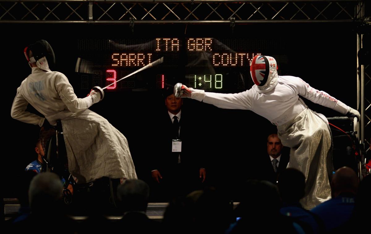 Alessio Sarri male wheelchair fencer Alessio Sarri leans back to avoid another fencer's foil
