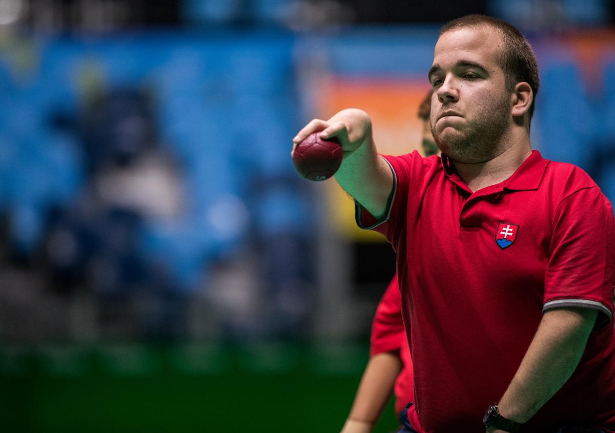 male boccia player Samuel Andrejcik throws a ball