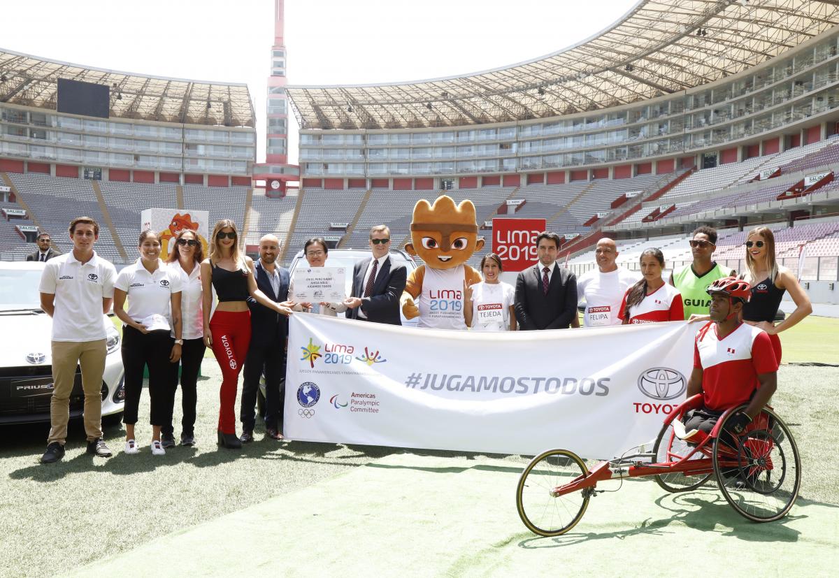 Lima 2019 - Toyota annoucement the Lima 2019 and a group of people standing in a stadium