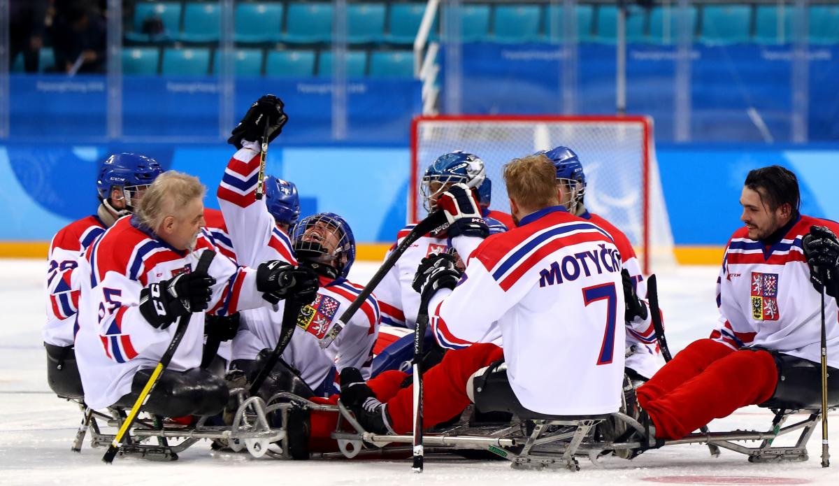 Czech Republic ice hockey - PyeongChang 2018 male Para ice hockey players from Czech Republic celebrating and hugging on the ice