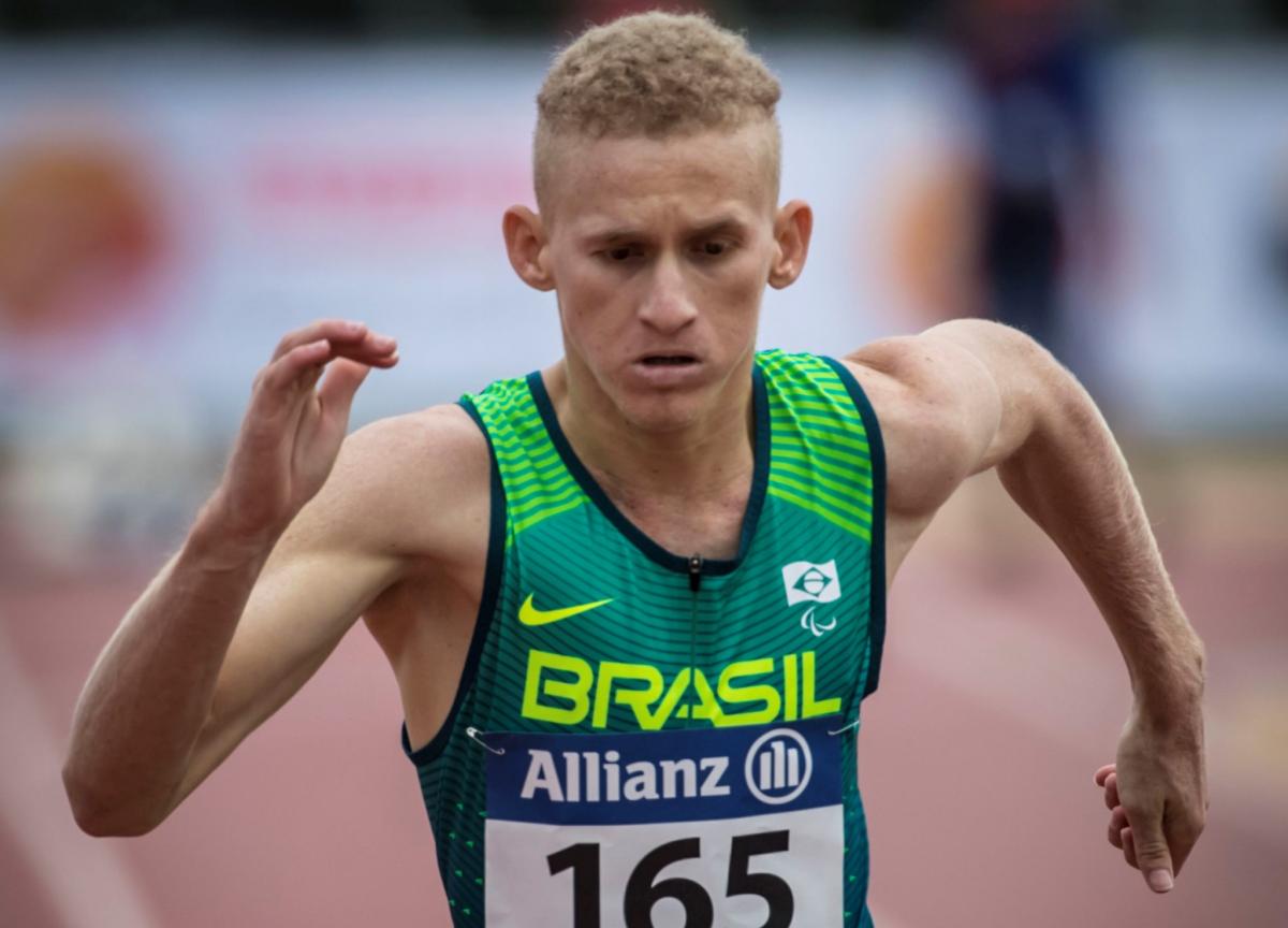 A man running on an athletics track