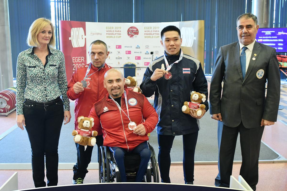 Juan Carlos Garrido holds his gold medal