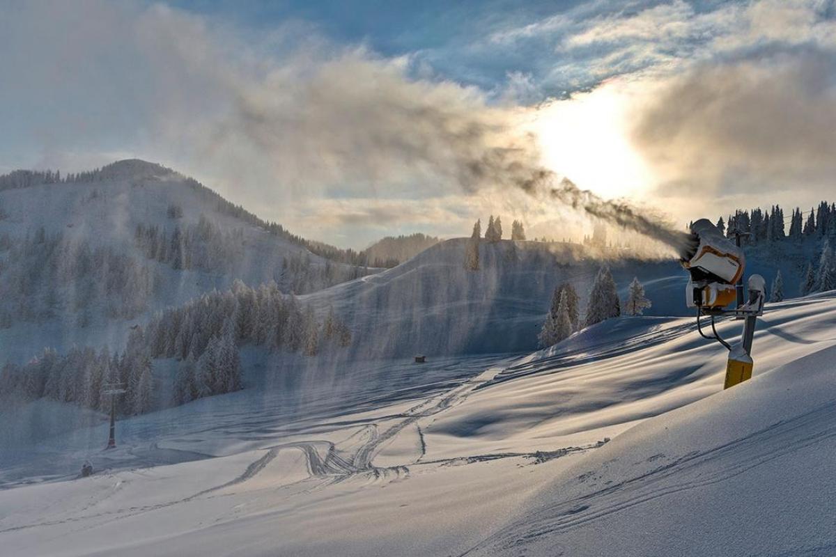 A snow making machine in the middle of snow