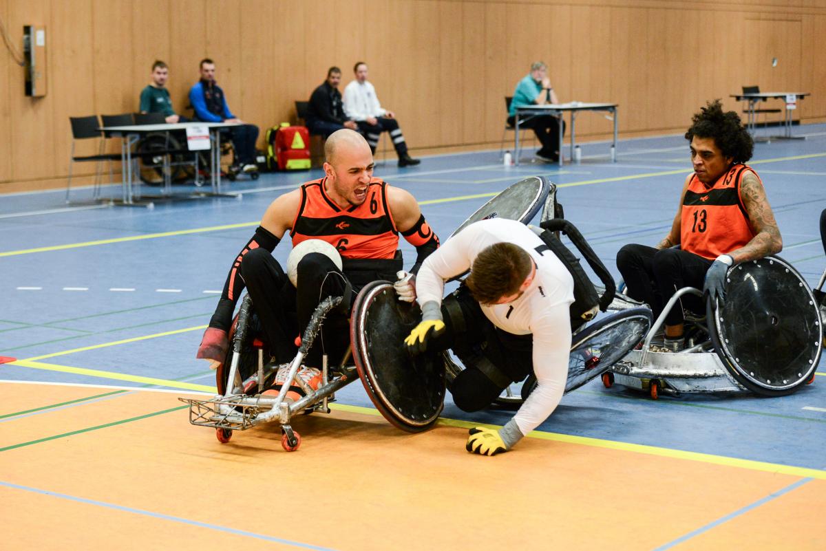 Reda Haouam - Netherlands - wheelchair rugby Two men in wheelchair chairs collide playing wheelchair rugby
