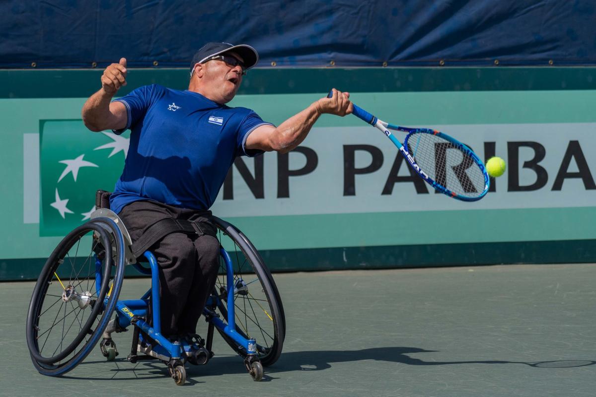 Shraga Weinberg - Israel - wheelchair tennis Israeli left-handed wheelchair tennis player Shraga Weinberg hits the ball during a game contested on a hard court