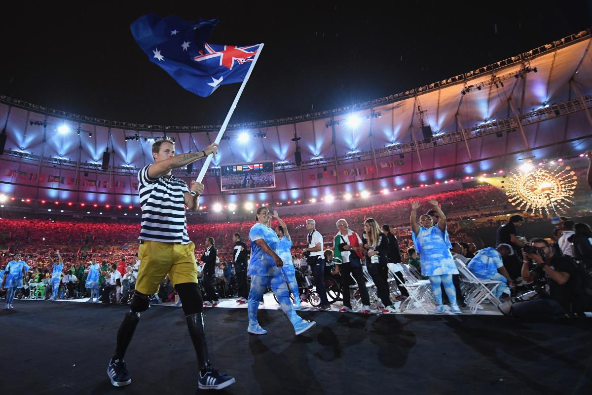 Australian Paralympian Curtis McGrath carries the country's flag at the Opening Ceremony of Rio 2016