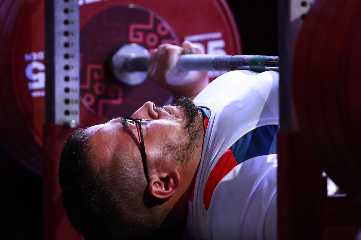 French powerlifter Rafik Arabat lifts the bar