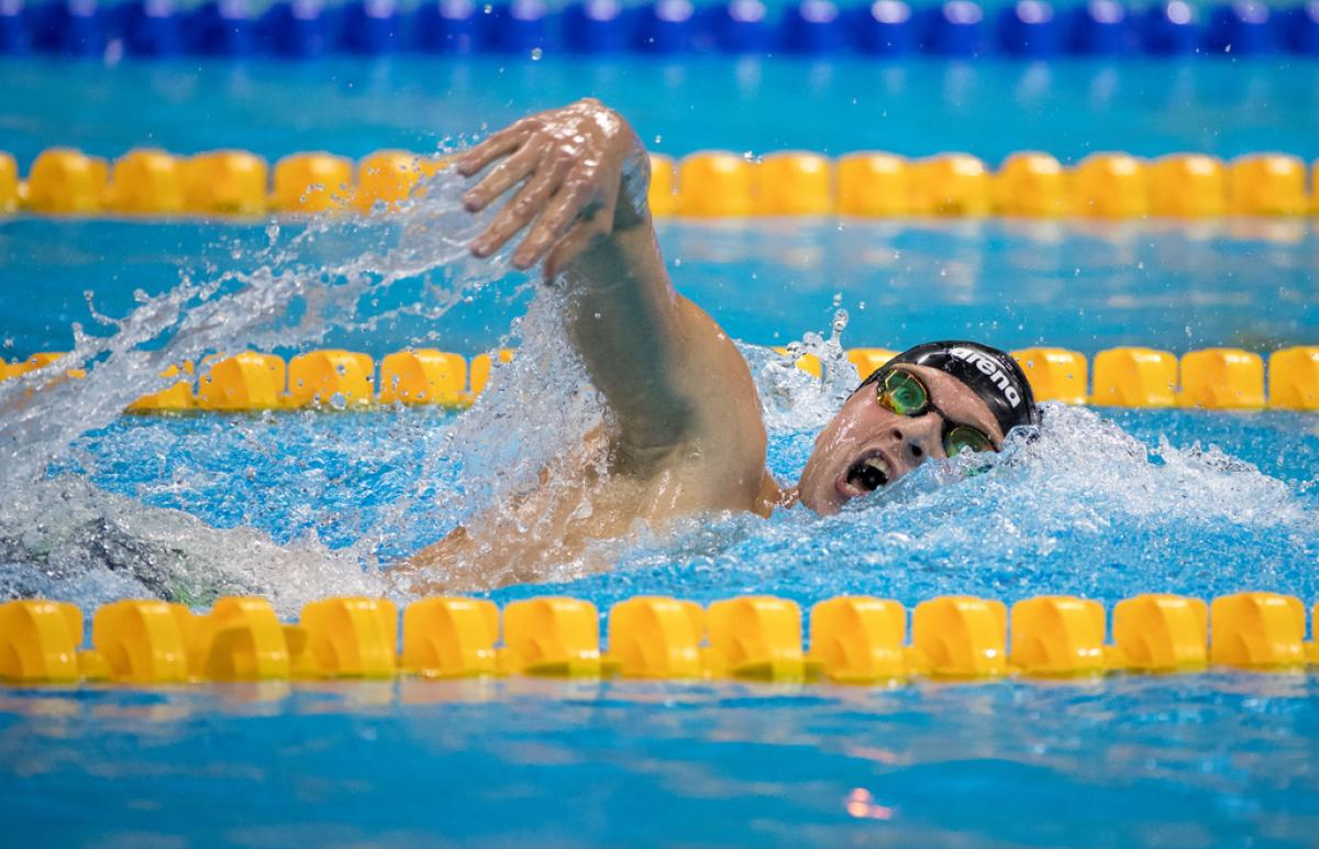 A man swimming in a pool