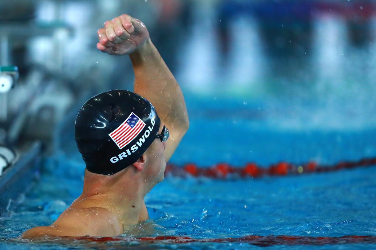 Robert Griswold - US - swimming male Para swimmer Robert Griswold punches the air in the pool after winning a race