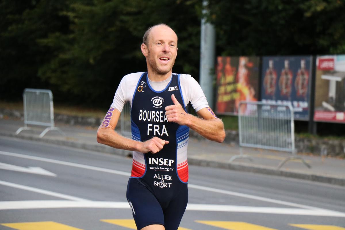 Yannick Bourseaux exhausted running to the finish line