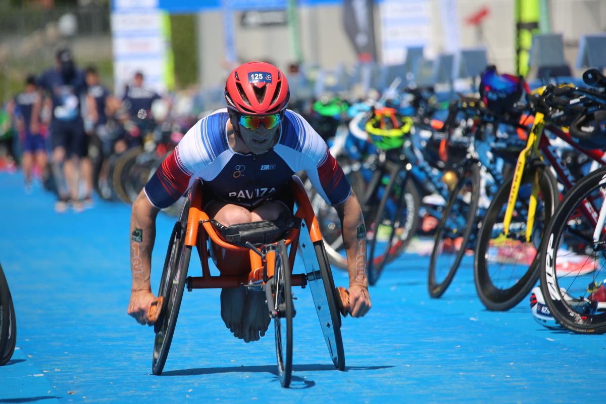 A male Para triathlete in a wheelchair race