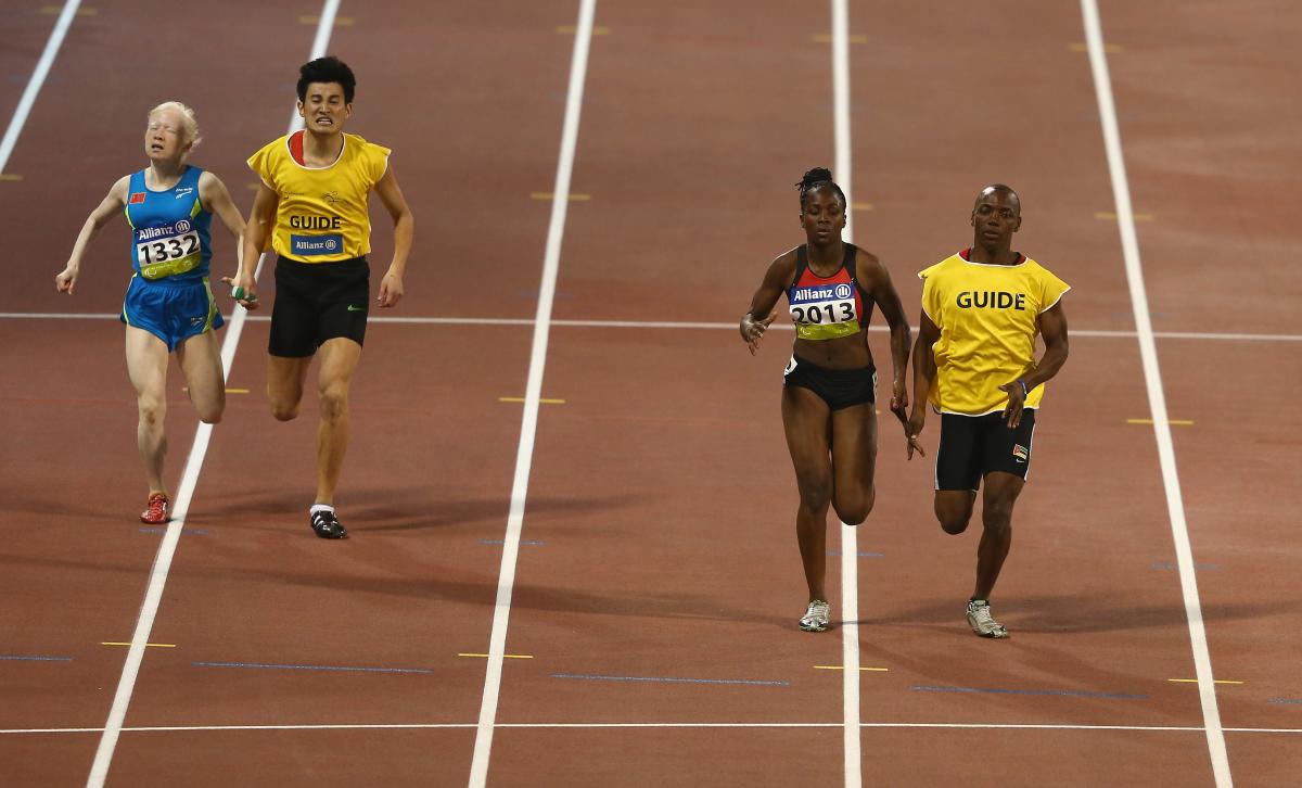 Edmilsa Governo - athletics - Mozambique Two female vision impaired sprinters racing with their guides