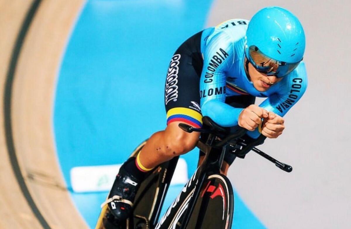 Colombian man riding his bike in a velodrome 