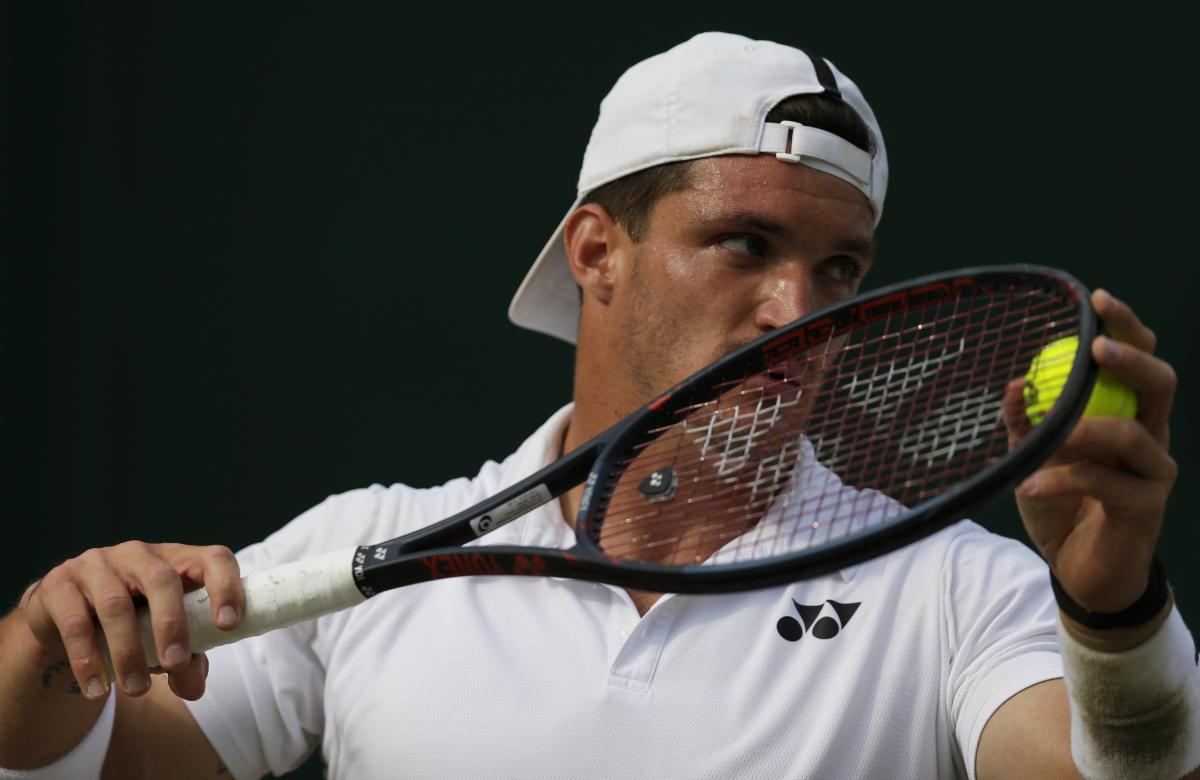 Close shot on Argentinian wheelchair tennis player Gustavo Fernandez about to serve