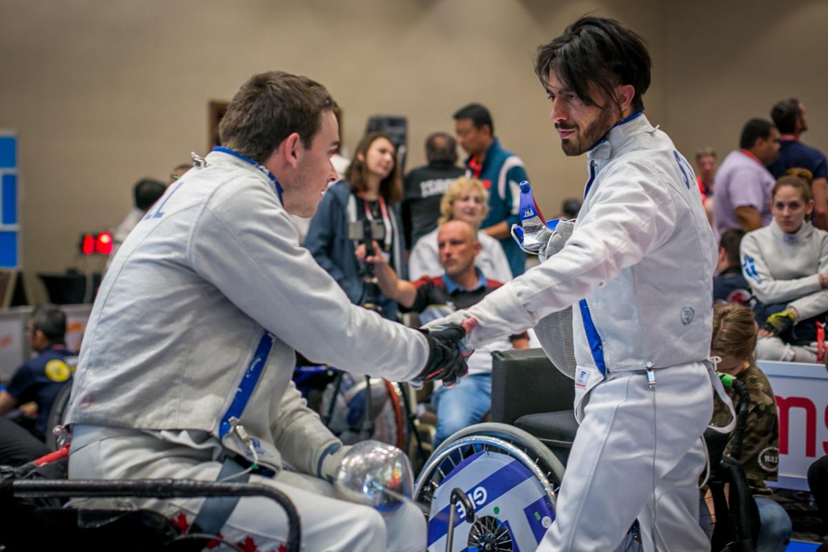 Wissam Sami - IWAS Fencing World Cup Iraq refugee Wissam Sami greets Canada's Ryan Roussel during the IWAS Wheelchair Fencing World Cup in Warsaw, Poland