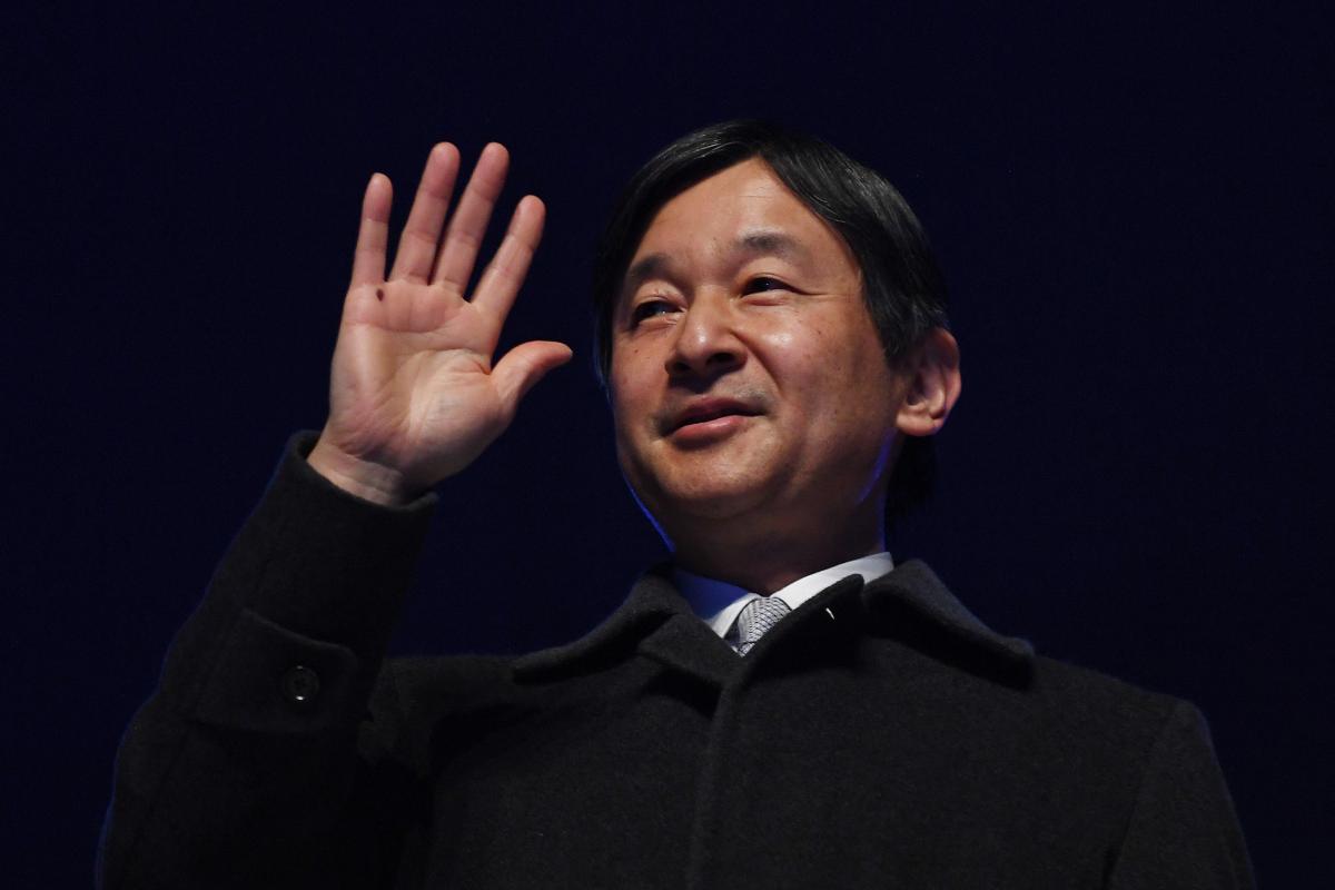 Emperor Naruhito of Japan waves to the crowd