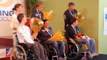 Alexandra Rickham (center) on top of the podium at the 2012 ISAF Sailing World Cup