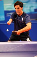 A spanish person playing table tennis