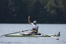 A man celebrating his rowing victory 