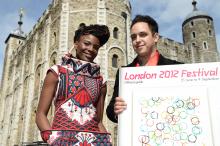 A picture of 2 standing people in front of a castle showing the London 2012 festival Official Guide.