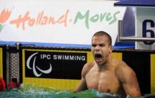 A picture of a man celebrating his victory in a pool