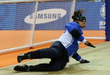A picture of a blind men playing Goalball