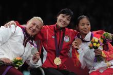 A picture of three women showing their medals