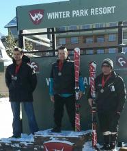 Adam Hall stands top of the podium at Winter Park