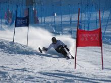 Austria's Claudia Loesch competes giant slalom on a sit ski