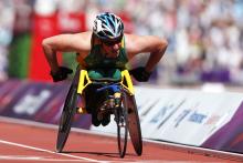 A picture of a man in a wheelchair during a wheelchair race