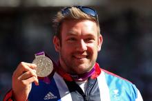 A picture of a man with a medal around his neck